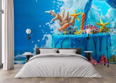 A bright blue birthday cake with ocean-themed decorations, in front of a vibrant blue background being poured to create a lively and tropical feel. Wall mural