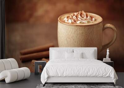 A creamy cinnamon dolce latte in a ceramic mug, with a warm cinnamon brown background to complement the drink Wall mural