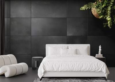 Top view of a contemporary tile pattern with large rectangular tiles in a matte black finish, laid out in a grid on a bathroom floor Wall mural