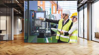 Male and Female Industrial Engineers in Hard Hats Discuss New Project or planning investment project working and strategy. business making conversation at Industrial injection molding factory concept Wall mural