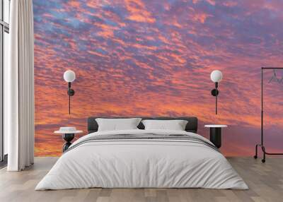 sunset with orange sky. Hot bright vibrant orange and yellow colors sunset sky. sunset with clouds Wall mural