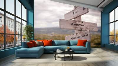 faith moves mountains text on wooden sign outdoors in nature. Religious and christianity quotes. Wall mural