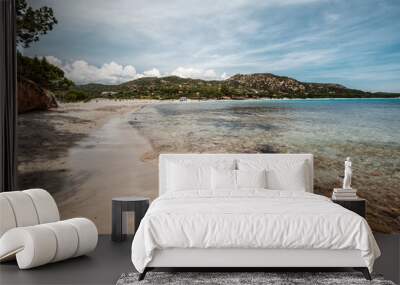 Mediterranean sea gently lapping onto the sandy beach at Plage de Folaca on the south east coast of the island of Corsica Wall mural