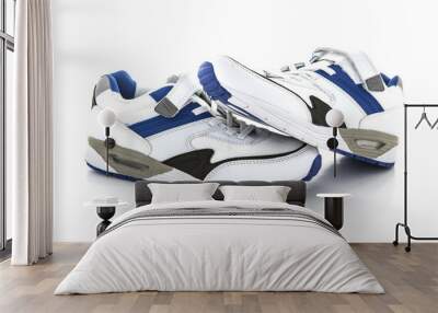 A new pair of white and blue trainers on a white background Wall mural