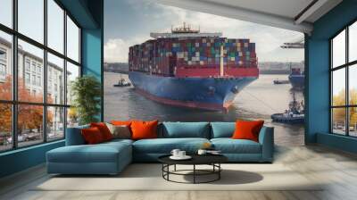 Container terminal in the port of Hamburg with large container ship and tugs Wall mural