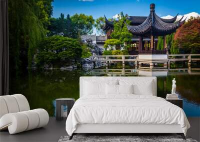 Pagoda reflecting in a pond at the Lan Su Chinese Garden, in Por Wall mural