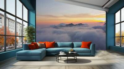 aerial photo above the clouds view of the sky at dusk Wall mural