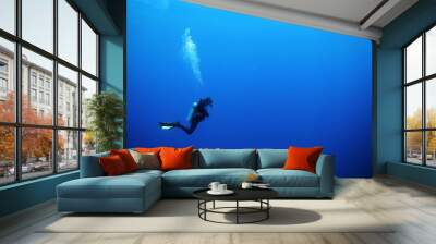 scuba diver in deep blue water Wall mural