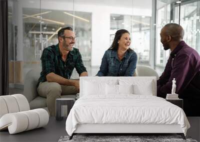 Candid real meeting of diverse successful business team smiling and socializing Wall mural