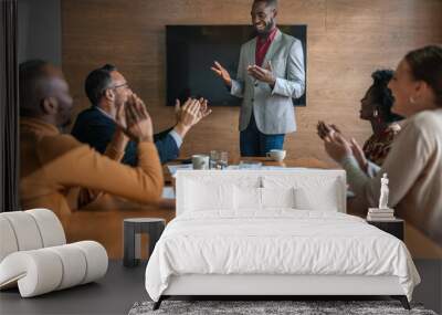 Diverse businesspeople clapping after a presentation in an office Wall mural