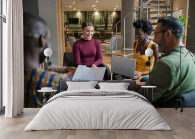 Diverse businesspeople discussing work during an office meeting Wall mural