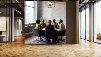 Diverse businesspeople having a casual meeting together in an of Wall mural