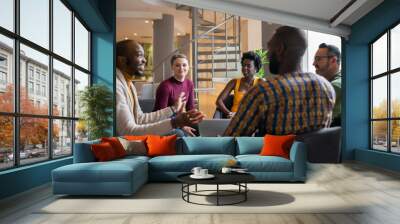 Group of diverse south african business people having a candid meeting in a modern work space Wall mural