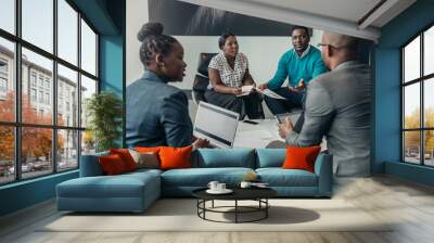 Team of african bussines people debating during a work meeting. Colleagues in serious discussions Wall mural