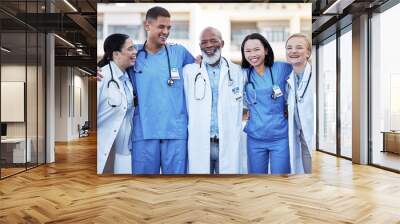 Healthcare, collaboration and doctors with nurses in medicine standing outdoor at a hospital as a team you can trust. Medical, teamwork or laughing with a man and woman medicine professional group Wall mural