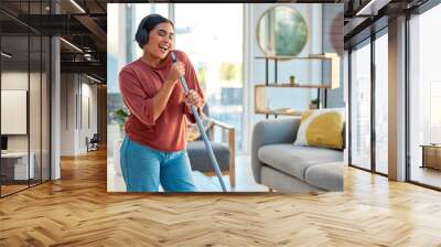 Singing, cleaning and headphones of a woman with music working in a home dancing with happiness. Spring cleaning, cleaner and happy person sing and dance with a mop in living room listening to audio Wall mural