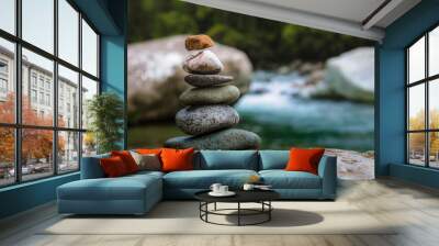 Rocks stacked in balance in a peaceful rainforest on the side of a river in a national park of Costa Rica Wall mural