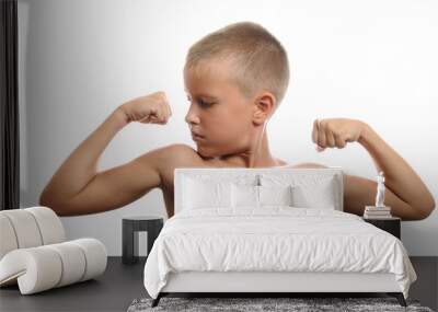 young boy flexes his muscles Wall mural