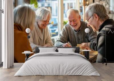 A group of older people are playing a board game together Wall mural