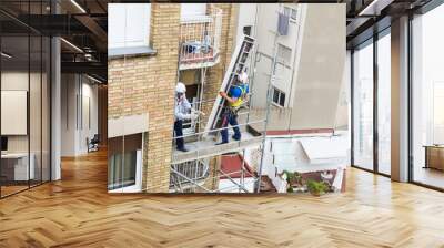 Construction workers working on scaffolding in Barcelona Wall mural