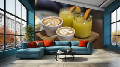 Couple of espresso coffee and orange juice on a wooden plate Wall mural