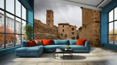 medieval tower and old houses in Villarroya de los Pinares, province of Teruel, Aragon, Spain Wall mural