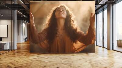 Christian worship and praise, a young woman with her arms raised Wall mural