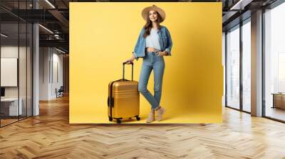 happy female traveler wears summer casual clothes and holds her suitcase Wall mural