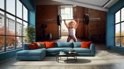 strong little girl lifting weights Wall mural