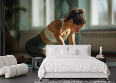 Woman Practicing Yoga Pose in Spacious Room Wall mural