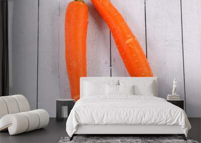 Top view of two carrots on a wooden table Wall mural