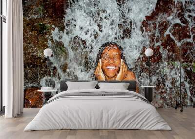 Black Woman Taking Bath From Waterfall Wall mural