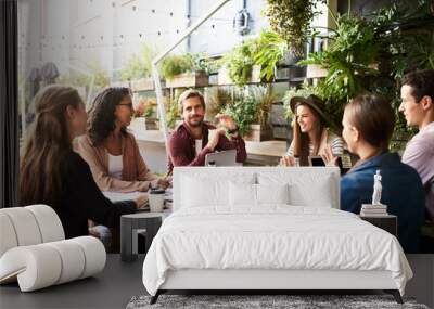 Creative, workshop and people in cafe for teamwork, strategy or online startup project development. Collaboration, men and women meeting in coffee shop with laptop, paperwork and design idea proposal Wall mural