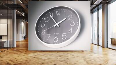 Minimalist clock hanging on a grey wall Wall mural