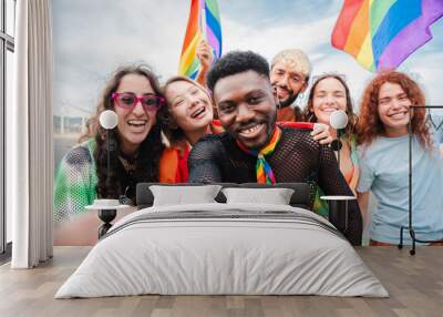 Happy multiracial young adult people having fun celebrating gay pride event. Group of diverse friends with different age and race having fun during LGBT social party. Sexual rights defense festival Wall mural