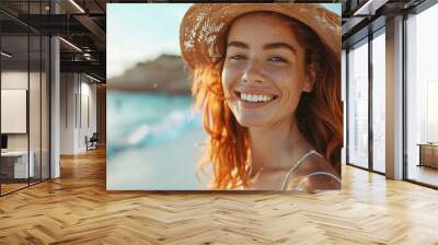 Red-haired woman on the seashore in summer Wall mural