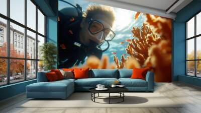 Diver exploring coral reef with vibrant marine life underwater. Wall mural