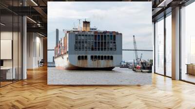 A large container ship sailing into the port of Savannah, GA Wall mural