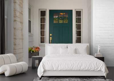 A detail of a front door on home with stone and white brick siding, stone sidewalk, and a colorful blue - green front door. Wall mural