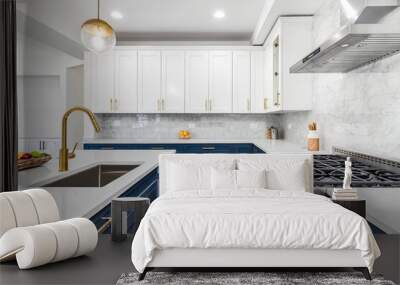 A luxurious white and blue kitchen with gold hardware, stainless steel appliances, and white marbled granite countertops. No brands or labels. Wall mural