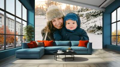 Happy mom and toddler in Winter Wall mural