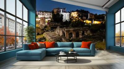 Rome, Italy - April 09, 2024: Night view of the ruins of the Roman Forum in Rome with tourists crowding its surroundings in Rome, Italy Wall mural