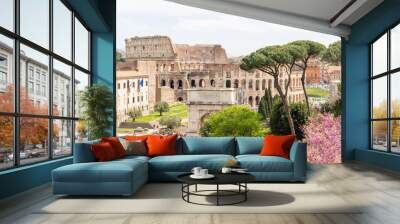 Rome, Italy - April 09, 2024: Ruins of the Roman Forum with tourists strolling among the archaeological remains in Rome, Italy Wall mural