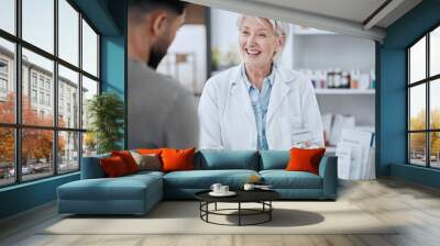 Happy senior woman, pharmacist and customer in consultation for medication or prescription at pharmacy. Mature female person, medical or healthcare employee consulting patient on pharmaceutical drugs Wall mural