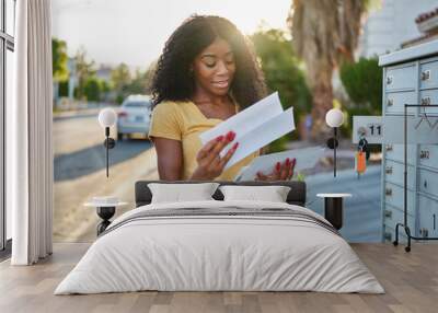 african american woman checking mail in las vegas community Wall mural