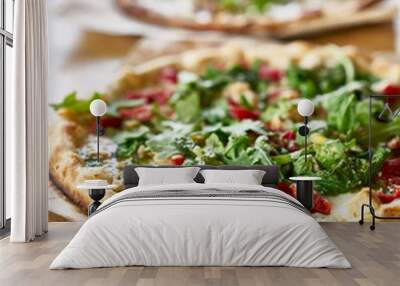 authentic oven fired pizza with pesto sauce and arugula Wall mural