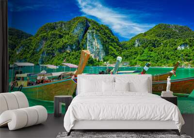 koh phi phi thailand with long tail boats floating on crystal clear water Wall mural