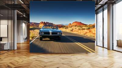 man driving vintage car through desert Wall mural