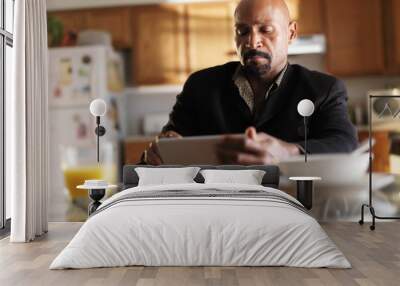 mature african man with tablet in kitchen and breakfast Wall mural