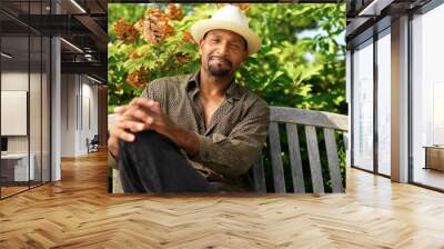 portrait of a mature african man relaxing outside Wall mural